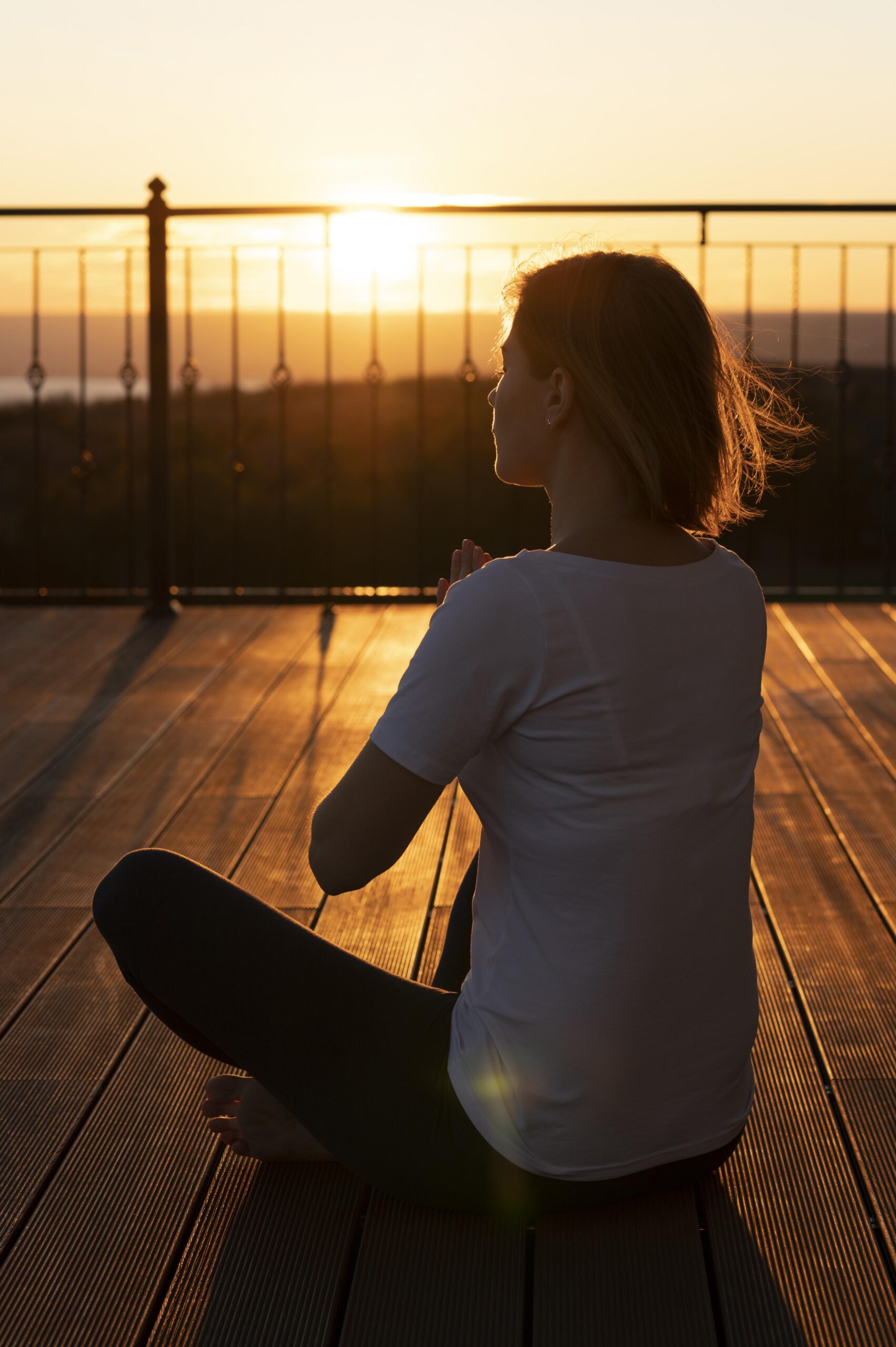 full shot woman sitting outdoors