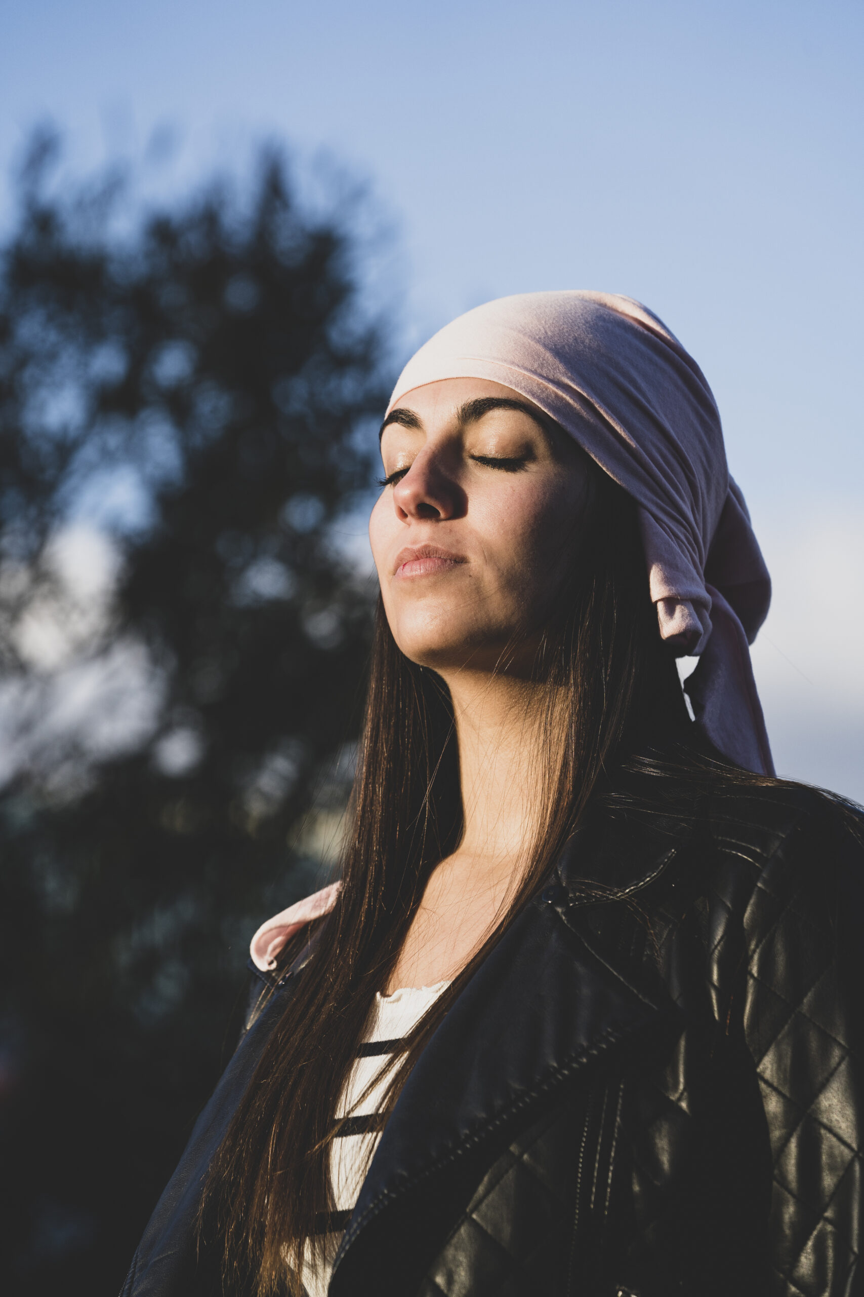 young beautiful woman with cancer bandana
